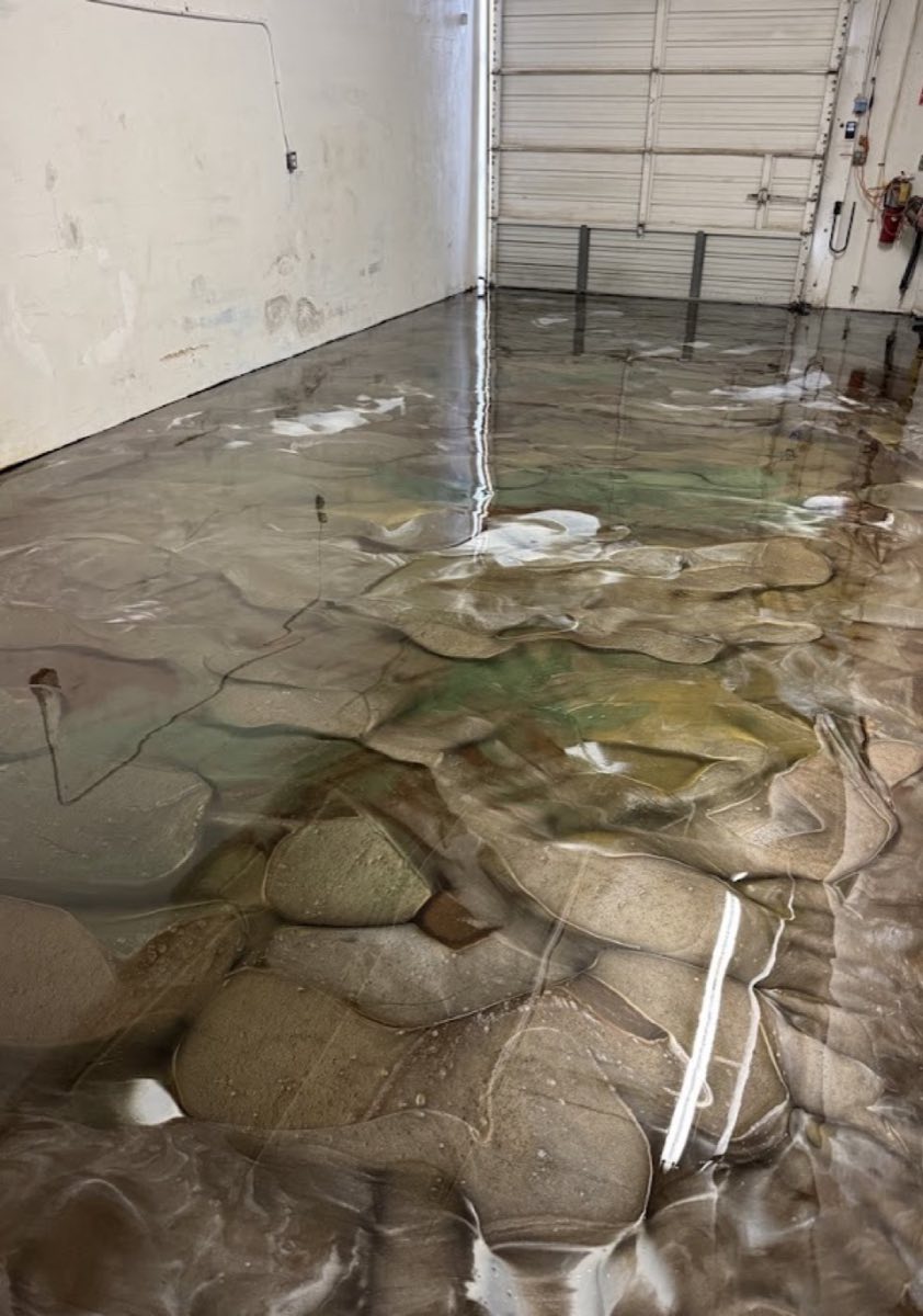 Bronze and cream metallic epoxy floor mid-pour