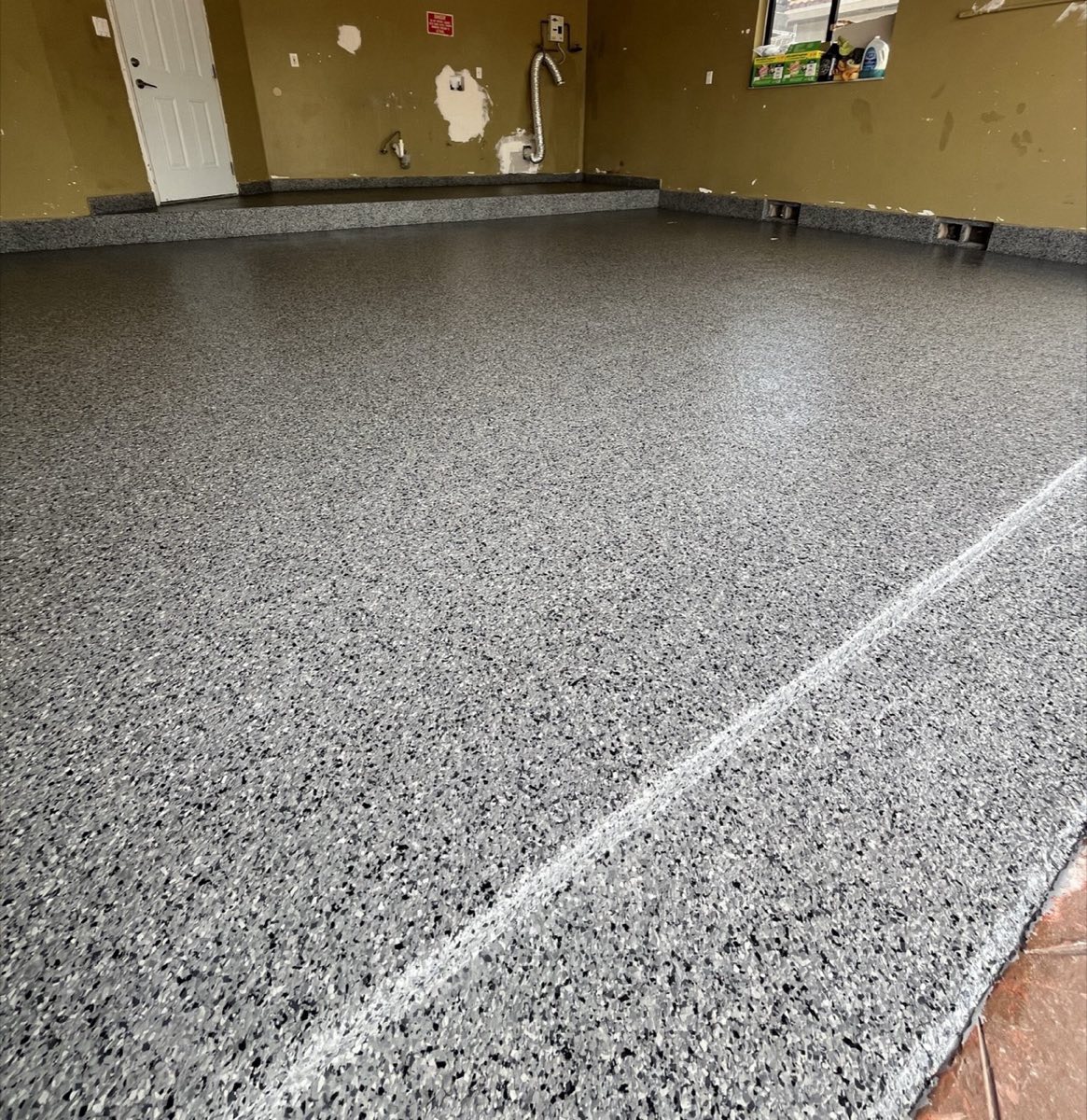 Flake Epoxy install by Suncrete Coatings